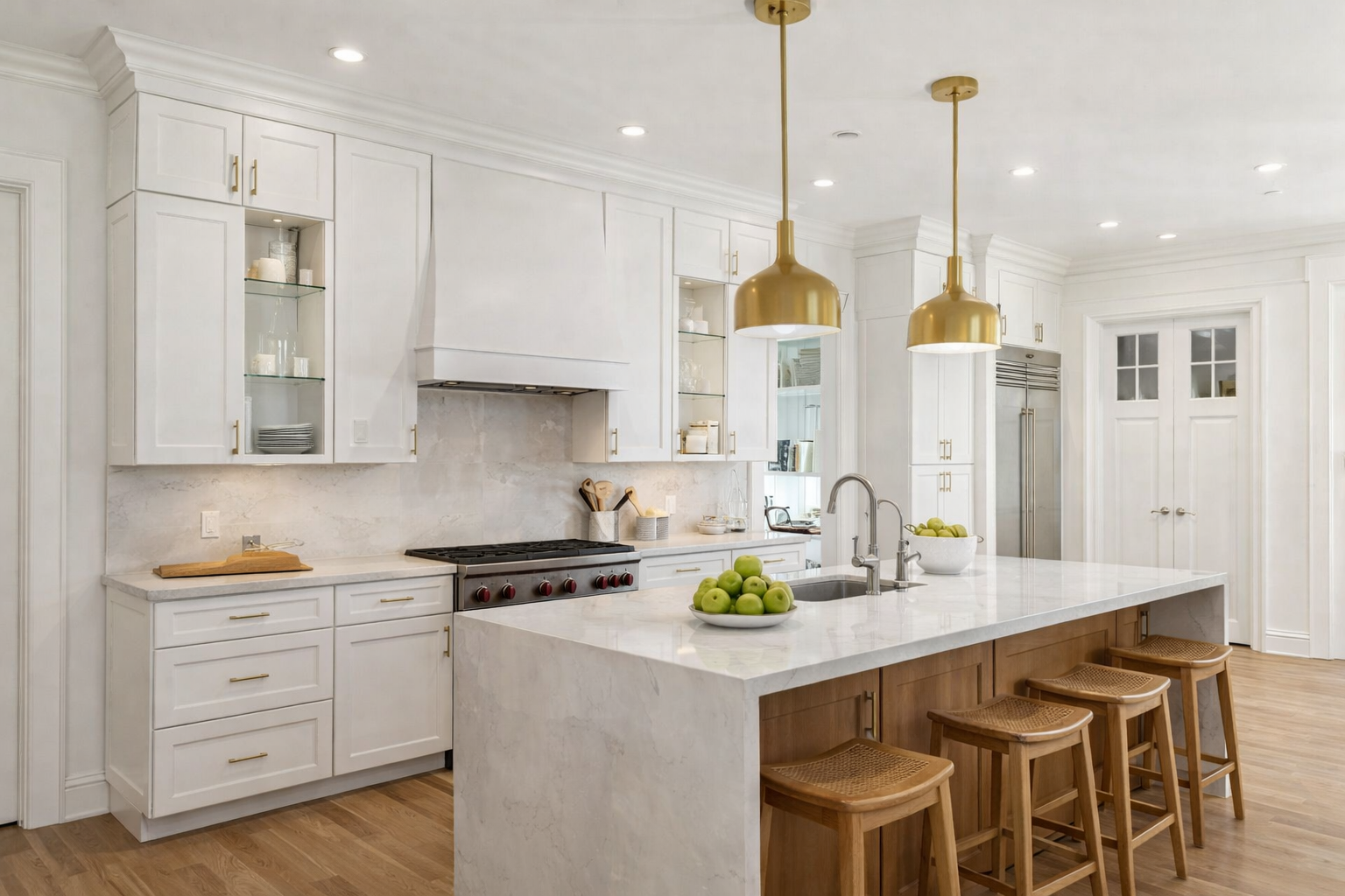 Upscale white kitchen with marble island